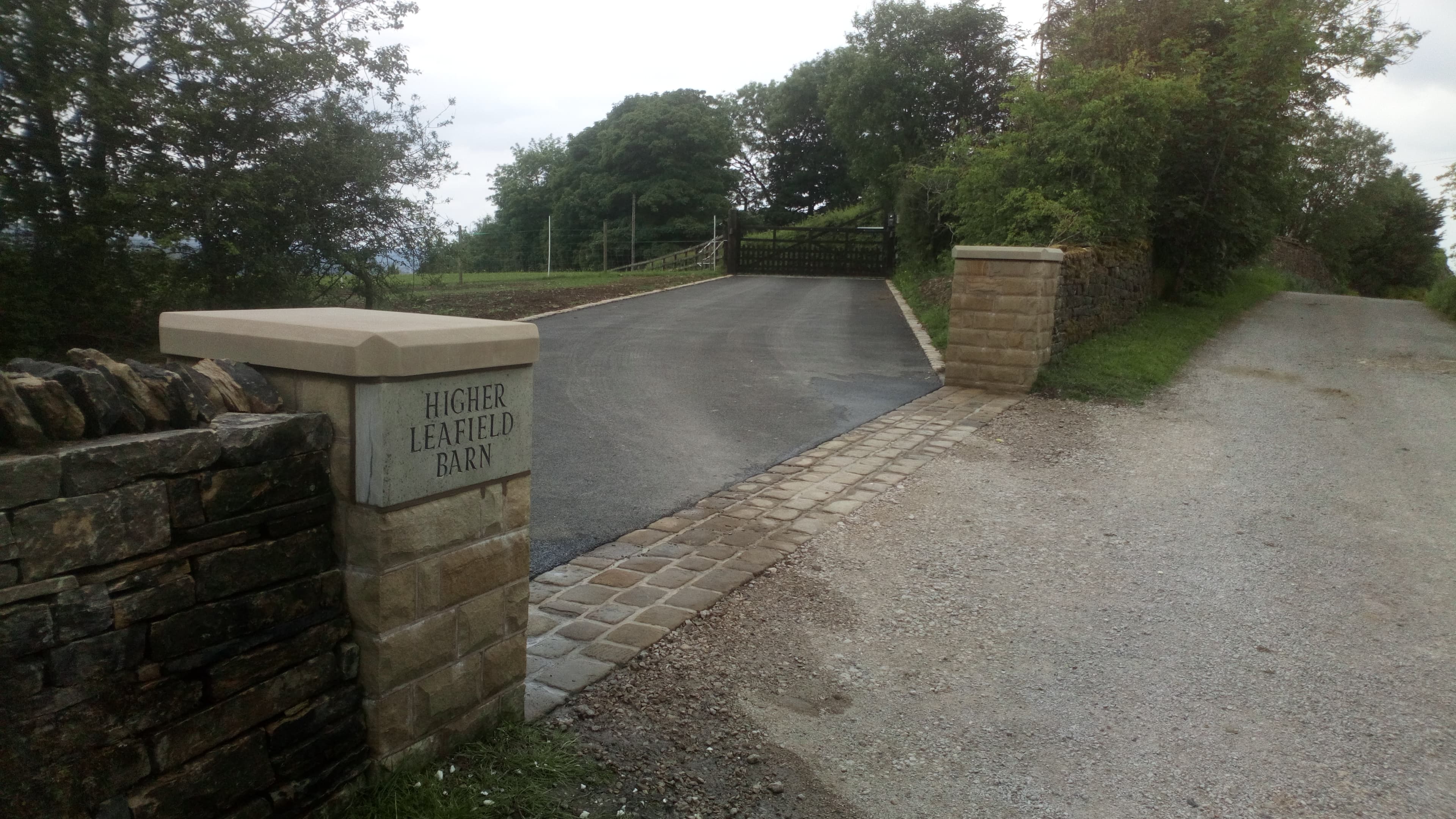 Higher Leafield Barn — sandstone gateposts, drystone walling and tarmac drive entrance