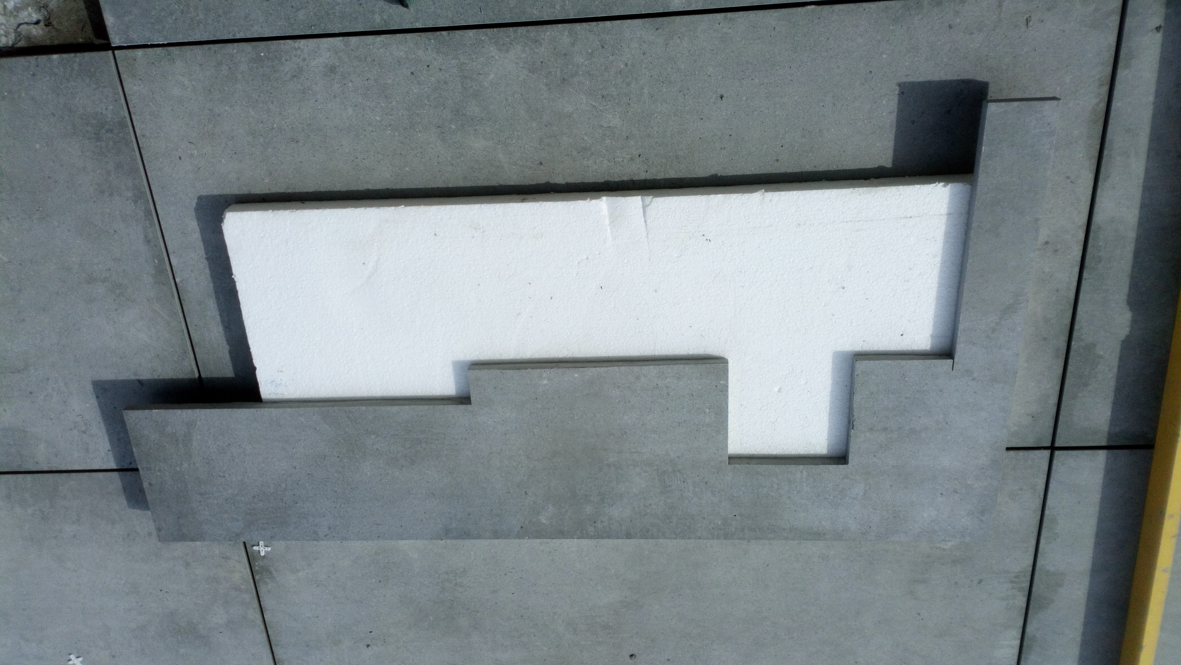 Recessed manhole tray cover cut from Brazilian grey porcelain