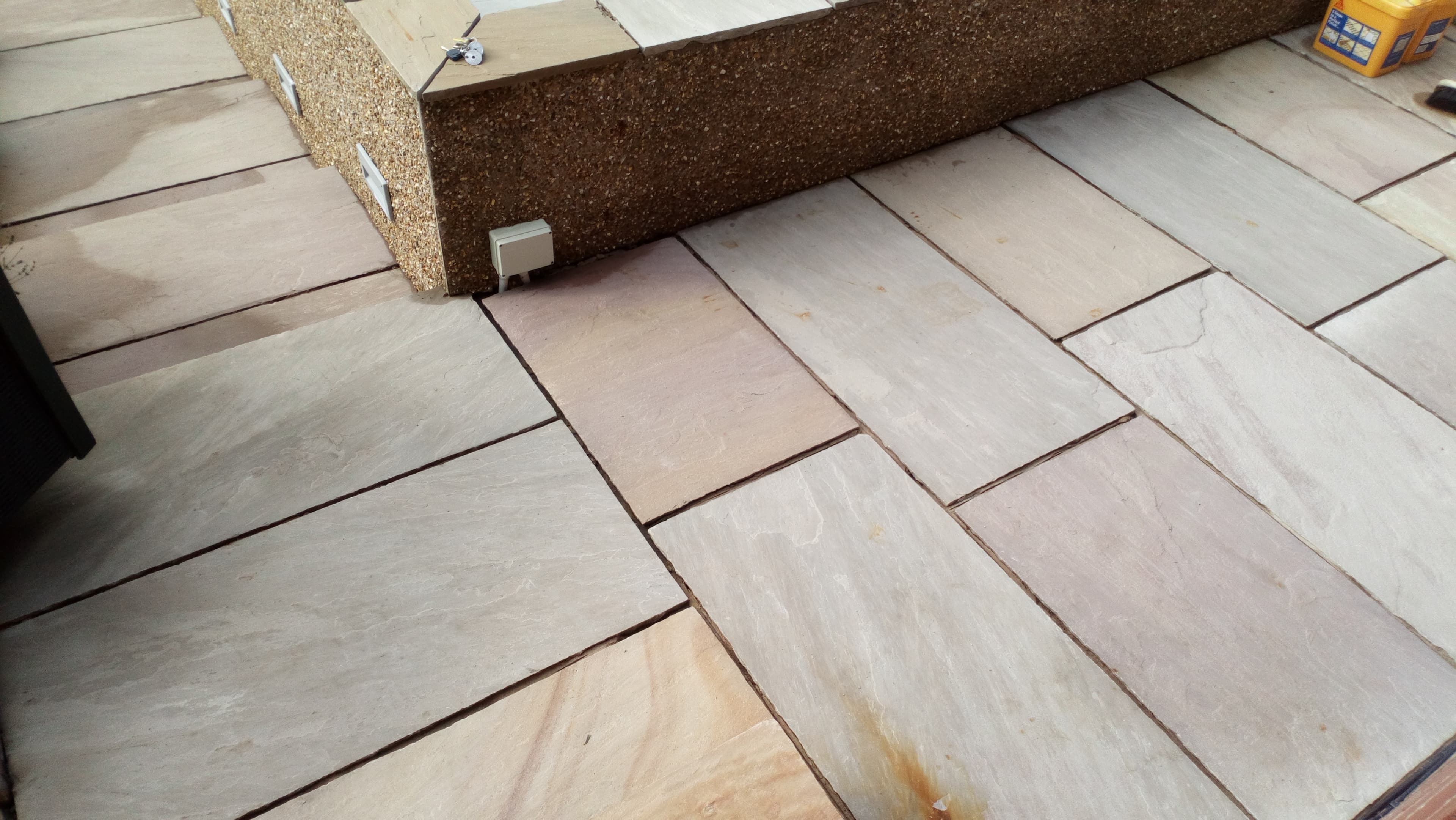 Riven Indian sandstone patio in mixed tones